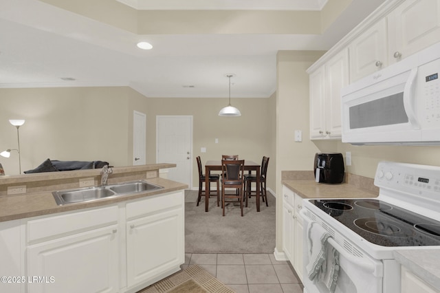 kitchen featuring crown molding, light tile patterned floors, white cabinets, a sink, and white appliances