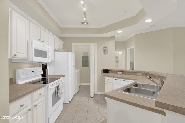 kitchen featuring a raised ceiling, visible vents, white cabinetry, a sink, and white appliances