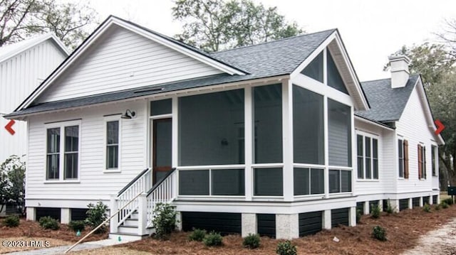 exterior space featuring a sunroom