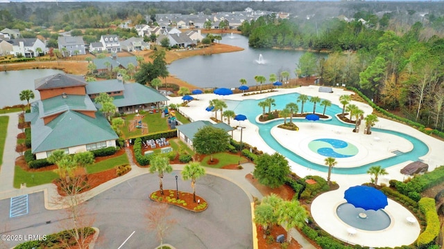 birds eye view of property featuring a water view and a residential view