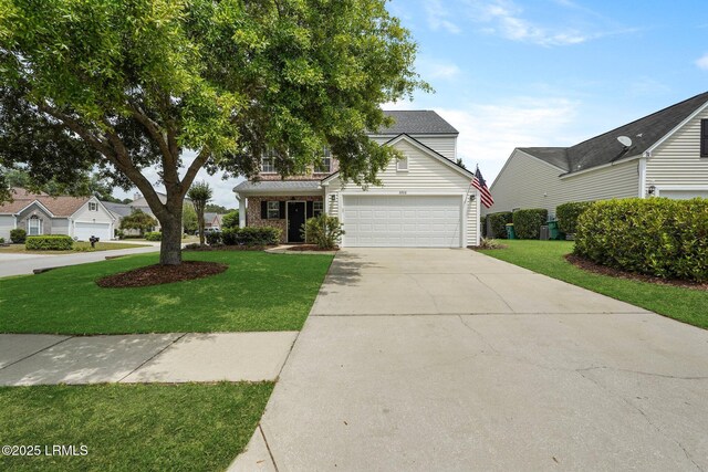 view of front facade featuring a front lawn, an attached garage, and concrete driveway