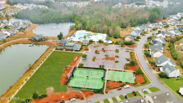 bird's eye view featuring a residential view, a water view, and a forest view