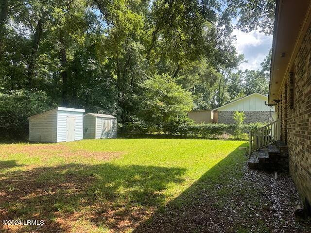 8 Taylor St, Beaufort, SC 29906 - view of yard featuring a storage unit
