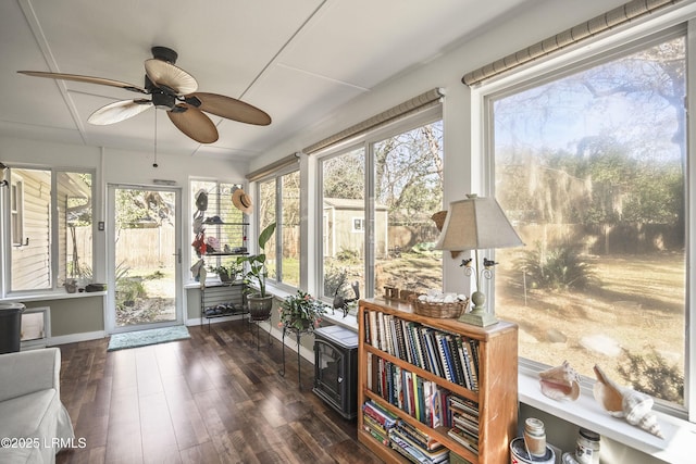 sunroom featuring ceiling fan