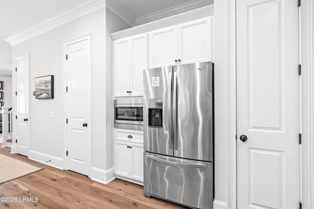 7 Canton Row, Beaufort, SC 29906 - kitchen with stainless steel appliances, light wood-style floors, crown molding, and white cabinetry