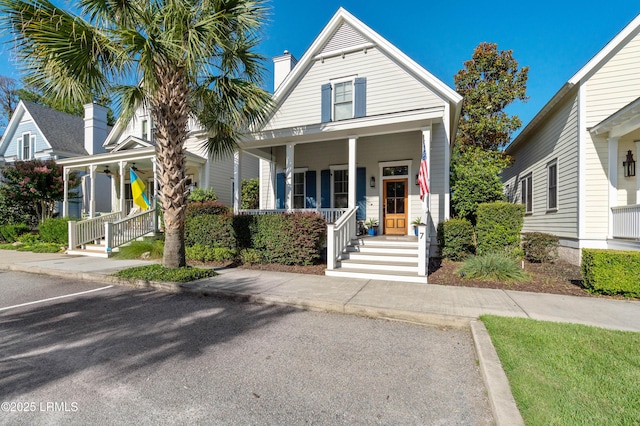 7 Canton Row, Beaufort, SC 29906 - view of front of home featuring covered porch and a chimney