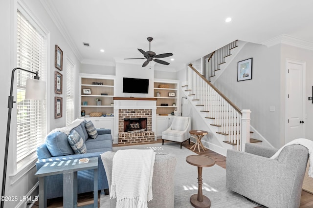 7 Canton Row, Beaufort, SC 29906 - living room with stairs, a ceiling fan, ornamental molding, a brick fireplace, and recessed lighting