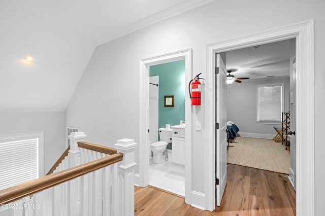 7 Canton Row, Beaufort, SC 29906 - hall with an upstairs landing, light wood finished floors, lofted ceiling, and ornamental molding