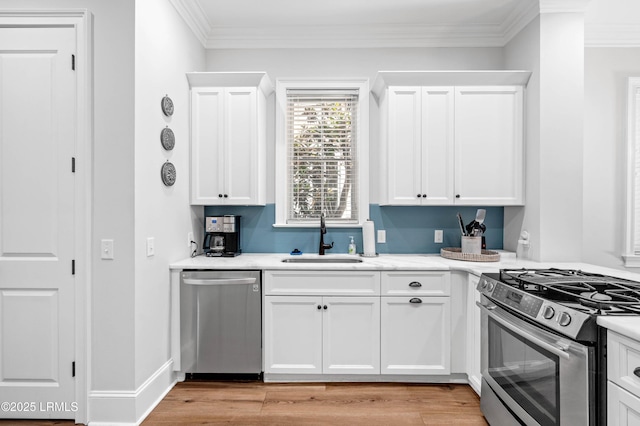 7 Canton Row, Beaufort, SC 29906 - kitchen with appliances with stainless steel finishes, light countertops, white cabinets, and ornamental molding