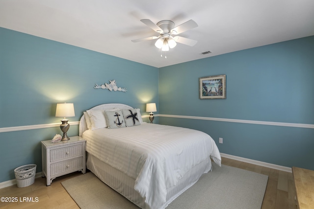 71 Skull Creek Dr Unit A302, Hilton Head Island, SC 29926 - bedroom with wood finished floors and ceiling fan