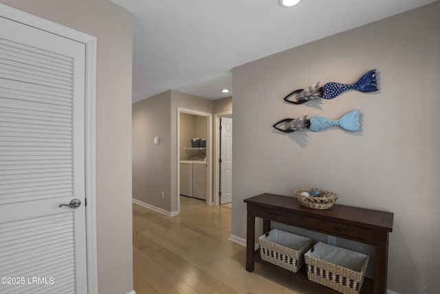 71 Skull Creek Dr Unit A302, Hilton Head Island, SC 29926 - corridor with washing machine and dryer, light wood-type flooring, and recessed lighting