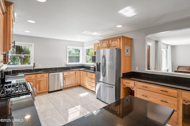 702 Center Dr W, Beaufort, SC 29902 - kitchen with stainless steel appliances, a sink, healthy amount of natural light, recessed lighting, and dark stone counters