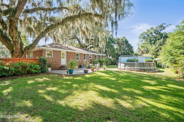 702 Center Dr W, Beaufort, SC 29902 - view of yard featuring entry steps, an outdoor pool, and a patio