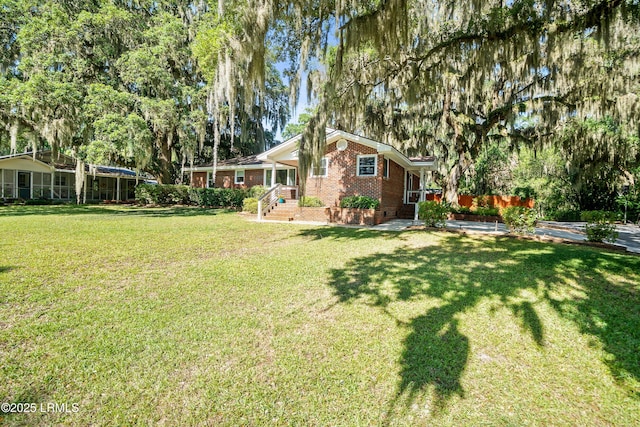 702 Center Dr W, Beaufort, SC 29902 - view of grassy yard with view of wooded area