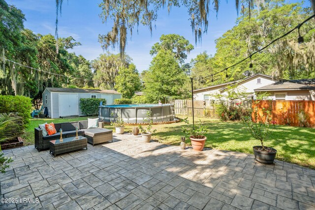 702 Center Dr W, Beaufort, SC 29902 - view of patio / terrace with a shed, outdoor lounge area, and an outbuilding