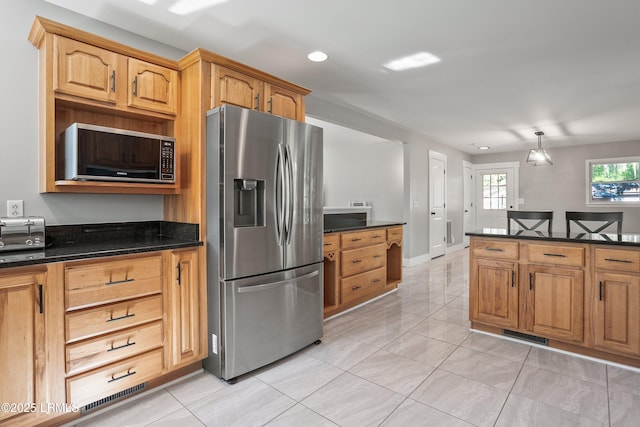 702 Center Dr W, Beaufort, SC 29902 - kitchen with appliances with stainless steel finishes, light tile patterned flooring, recessed lighting, and dark stone countertops