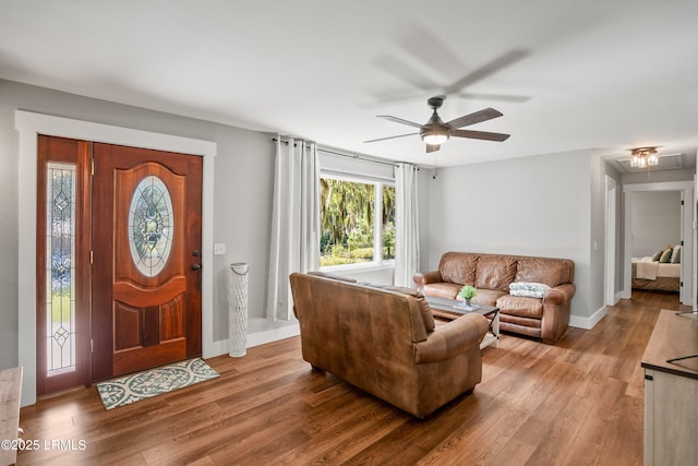 702 Center Dr W, Beaufort, SC 29902 - living room featuring wood finished floors, ceiling fan, baseboards, and attic access