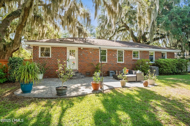 702 Center Dr W, Beaufort, SC 29902 - back of house featuring brick siding, cooling unit, and a patio