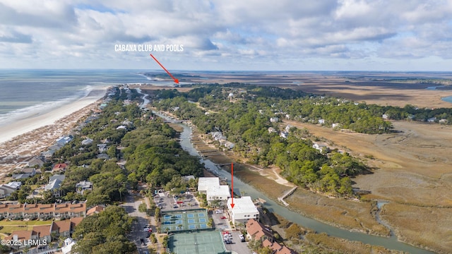 bird's eye view featuring a water view and a beach view