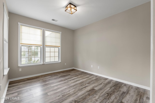 spare room featuring light hardwood / wood-style floors