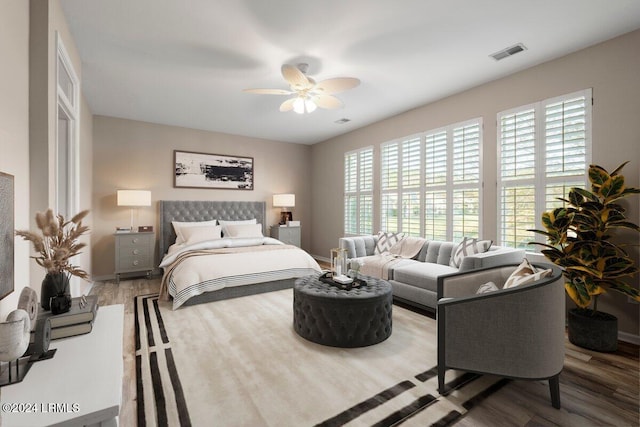 bedroom featuring hardwood / wood-style flooring and ceiling fan