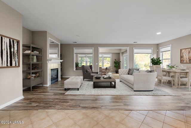 living room featuring a wealth of natural light and light wood-type flooring