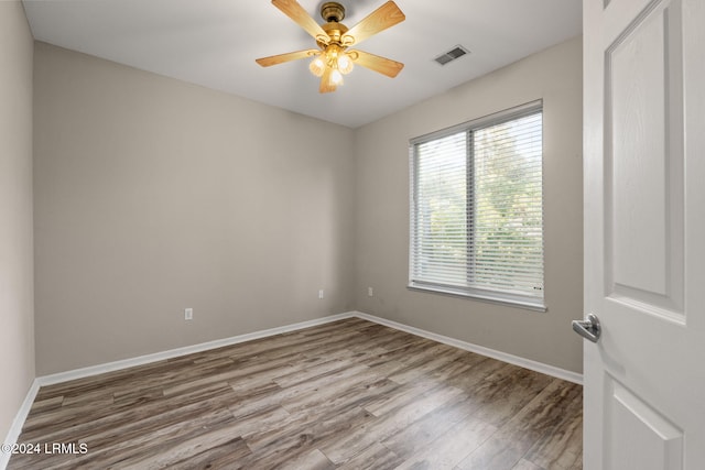 unfurnished room featuring hardwood / wood-style floors and ceiling fan