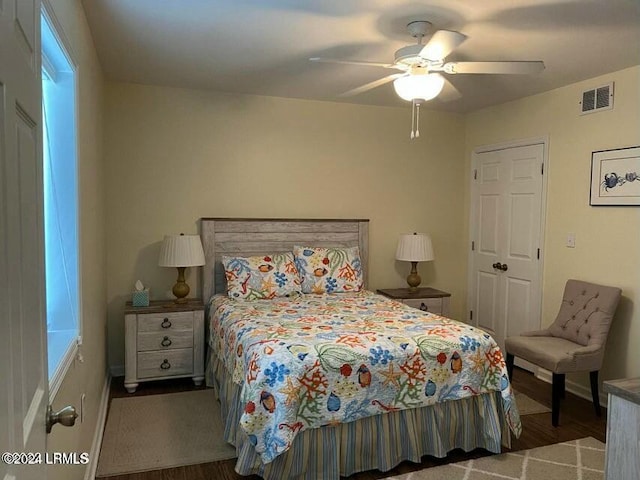 bedroom with hardwood / wood-style flooring and ceiling fan