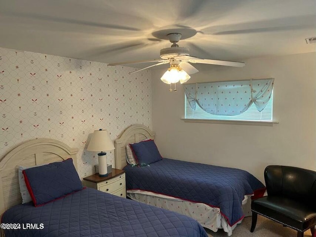 bedroom featuring ceiling fan and carpet floors