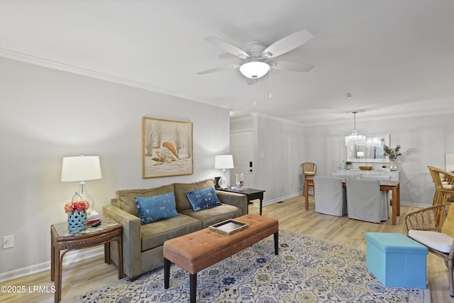 7 Three Mast Ln Unit 7, Hilton Head Island, SC 29928 - living area with wood finished floors, crown molding, ceiling fan, a chandelier, and baseboards