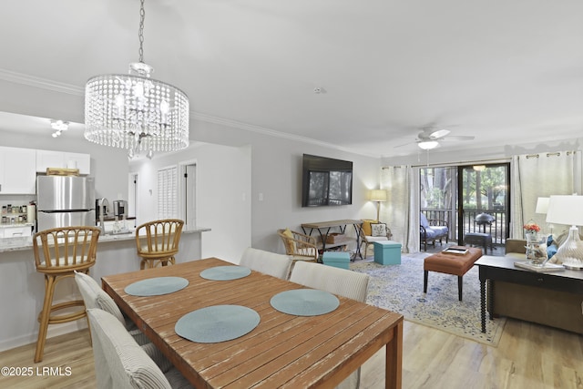 7 Three Mast Ln Unit 7, Hilton Head Island, SC 29928 - dining area featuring light wood-type flooring, a ceiling fan, ornamental molding, and a chandelier