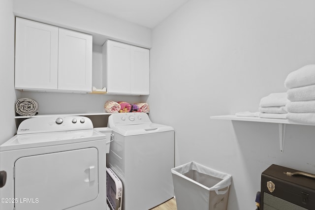7 Three Mast Ln Unit 7, Hilton Head Island, SC 29928 - laundry room with separate washer and dryer, cabinet space, and light wood-type flooring