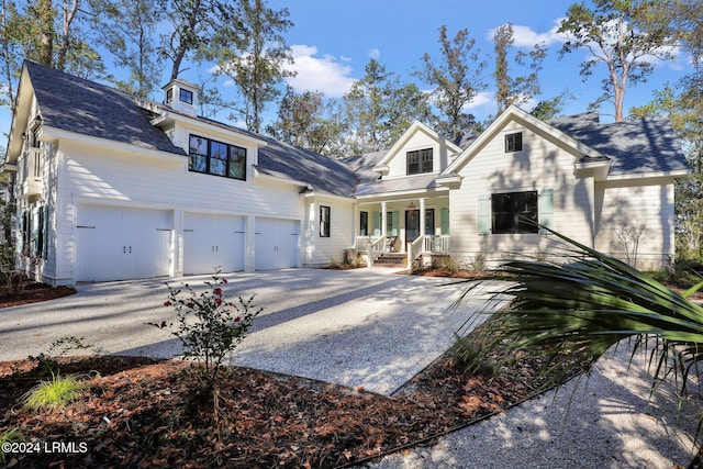 view of front facade featuring a garage and covered porch