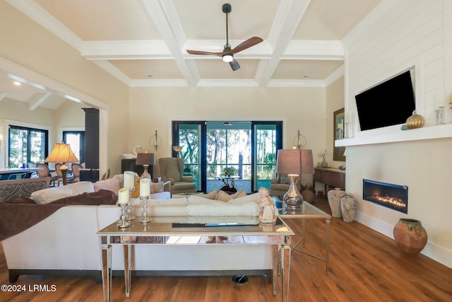 living room with coffered ceiling, beam ceiling, ceiling fan, and hardwood / wood-style flooring