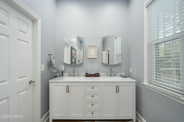 277 Pleasant Point Dr, Beaufort, SC 29907 - bathroom featuring double vanity and baseboards