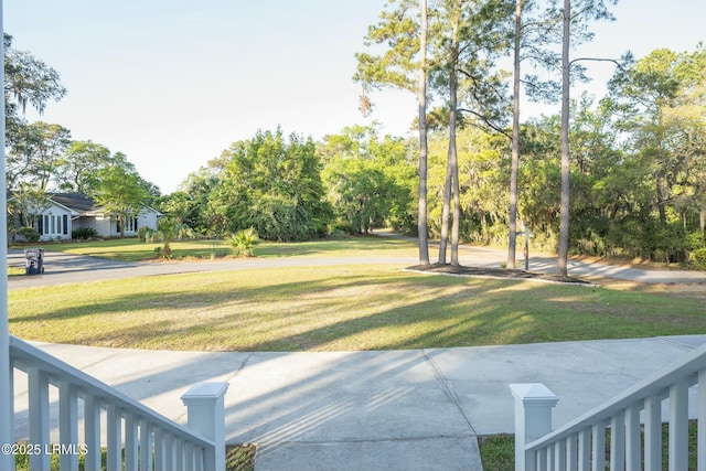 277 Pleasant Point Dr, Beaufort, SC 29907 - view of green lawn featuring view of wooded area