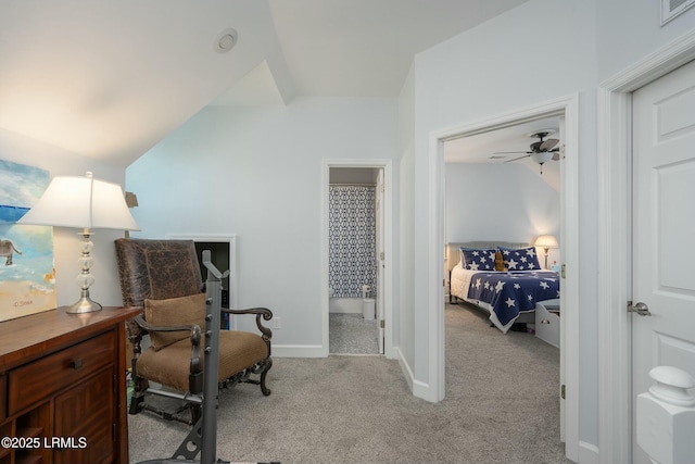 277 Pleasant Point Dr, Beaufort, SC 29907 - bedroom with light carpet, lofted ceiling, an office area, and baseboards