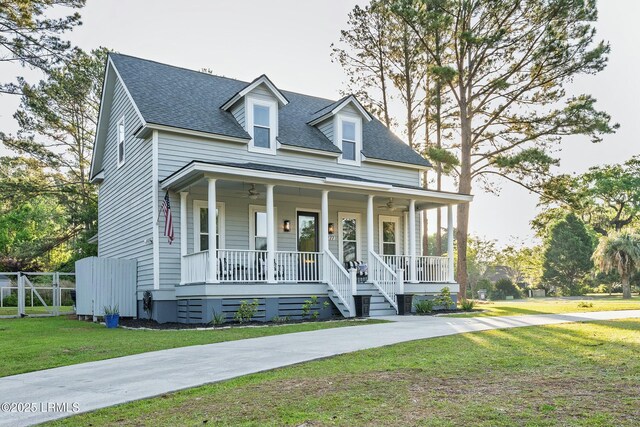 277 Pleasant Point Dr, Beaufort, SC 29907 - view of front facade with covered porch, ceiling fan, and a shingled roof