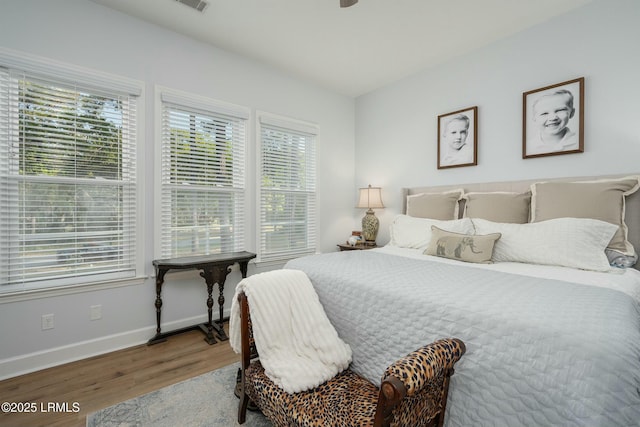 277 Pleasant Point Dr, Beaufort, SC 29907 - bedroom featuring wood finished floors and baseboards