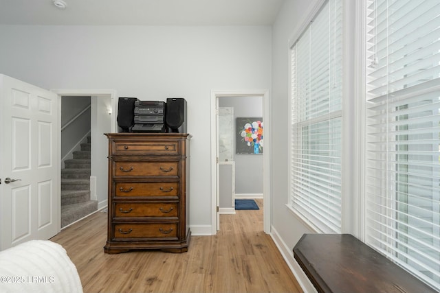 277 Pleasant Point Dr, Beaufort, SC 29907 - bedroom with light wood-style floors and baseboards