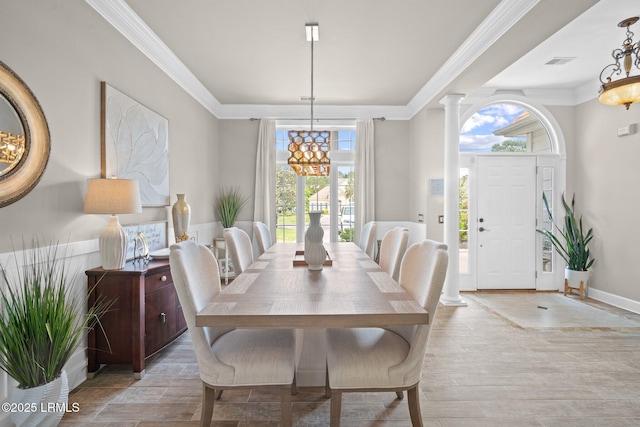 56 Waterford Dr, Bluffton, SC 29910 - dining space featuring ornamental molding, ornate columns, and light wood-style flooring