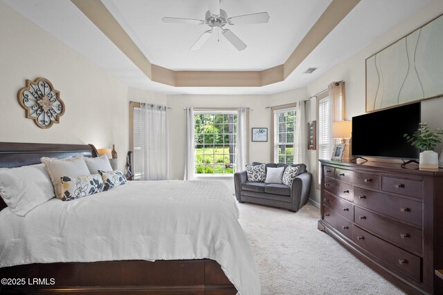 56 Waterford Dr, Bluffton, SC 29910 - carpeted bedroom featuring a tray ceiling and ceiling fan