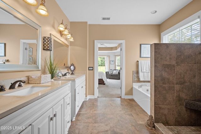56 Waterford Dr, Bluffton, SC 29910 - bathroom featuring double vanity, connected bathroom, and a garden tub