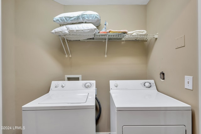 clothes washing area featuring washing machine and dryer