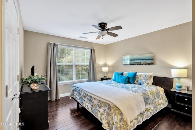 bedroom with dark wood-type flooring and ceiling fan