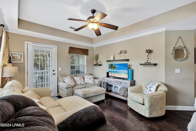 living room featuring ceiling fan, dark hardwood / wood-style floors, and a raised ceiling