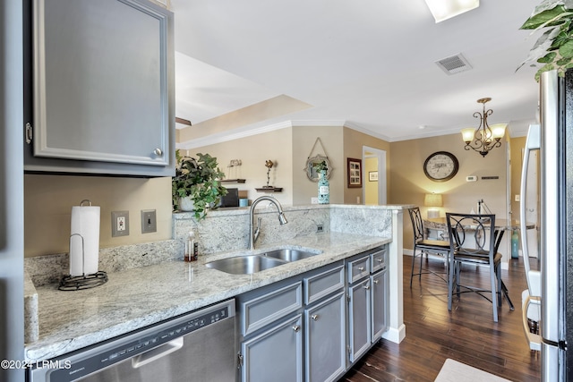 kitchen with gray cabinets, pendant lighting, sink, and stainless steel dishwasher