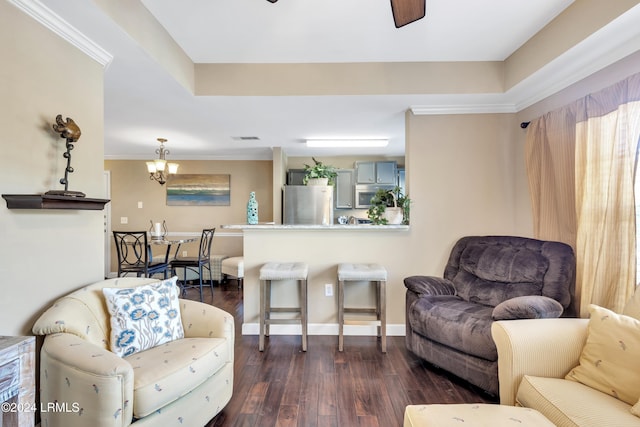 living room with dark hardwood / wood-style flooring and a notable chandelier