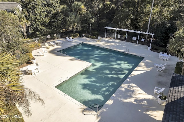 view of swimming pool with a pergola and a patio