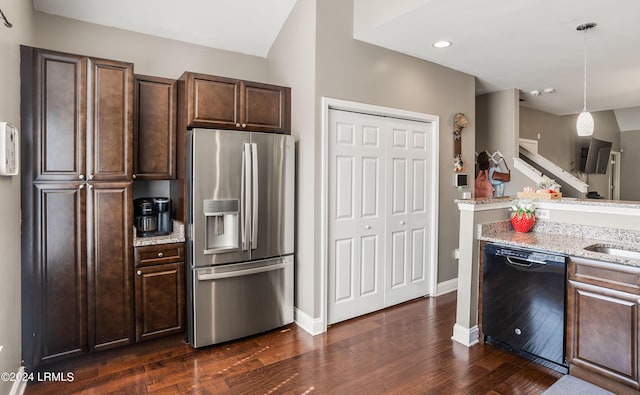 kitchen featuring stainless steel refrigerator with ice dispenser, dark brown cabinetry, hanging light fixtures, dishwasher, and light stone countertops